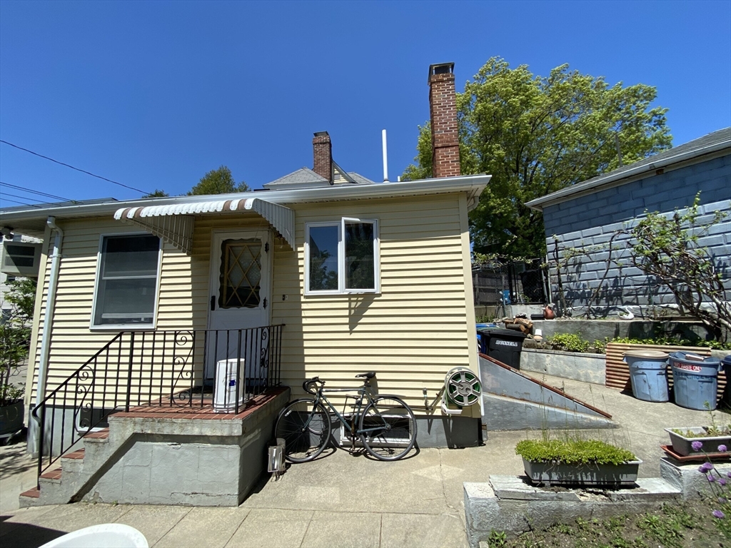 213 Holland Street, Unit R Somerville, MA 02144 - Photo 21 of 23 a front view of a house with sitting area