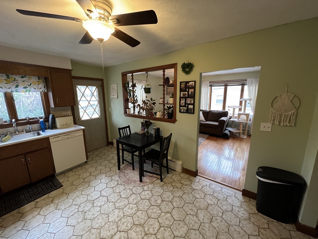 213 Holland Street, Unit R Somerville, MA 02144 - Photo 5 of 23 a view of a livingroom with furniture hardwood floor and a ceiling fan