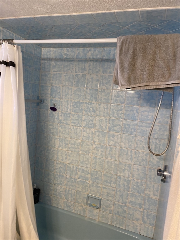 213 Holland Street, Unit R Somerville, MA 02144 - Photo 8 of 23 a bathroom with a shower