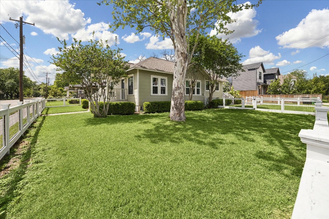 623 Pecore Street Houston, TX 77009 - Photo 19 of 19 a view of a house with a big yard and a large tree