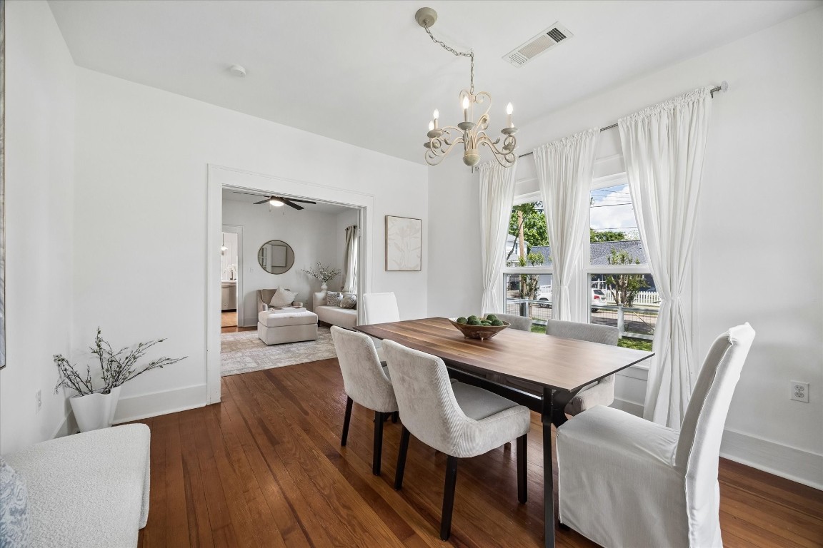 623 Pecore Street Houston, TX 77009 - Photo 3 of 19 a view of a dining room with furniture window and wooden floor