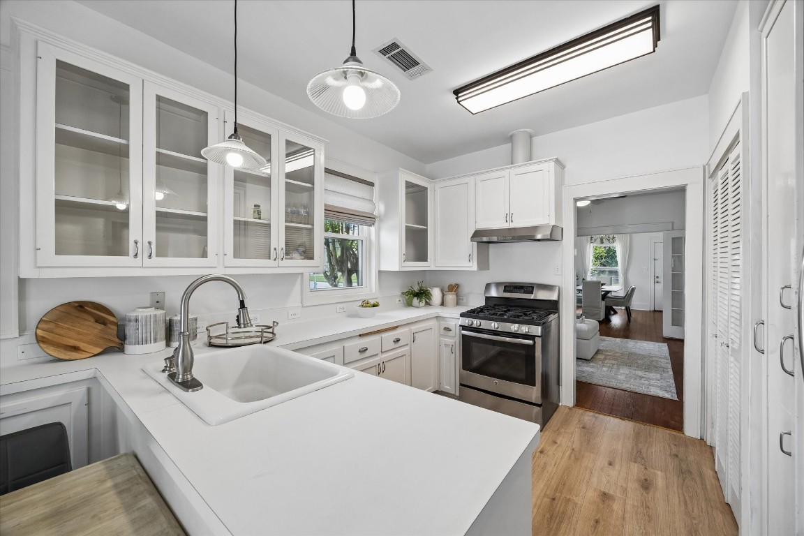 623 Pecore Street Houston, TX 77009 - Photo 5 of 19 a kitchen with stainless steel appliances granite countertop a sink stove and refrigerator