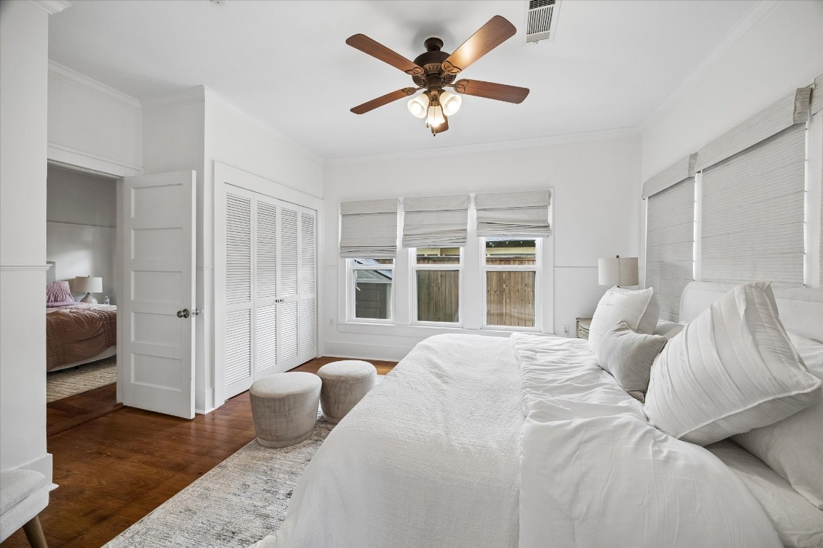 623 Pecore Street Houston, TX 77009 - Photo 10 of 19 a bedroom with a bed and a large window