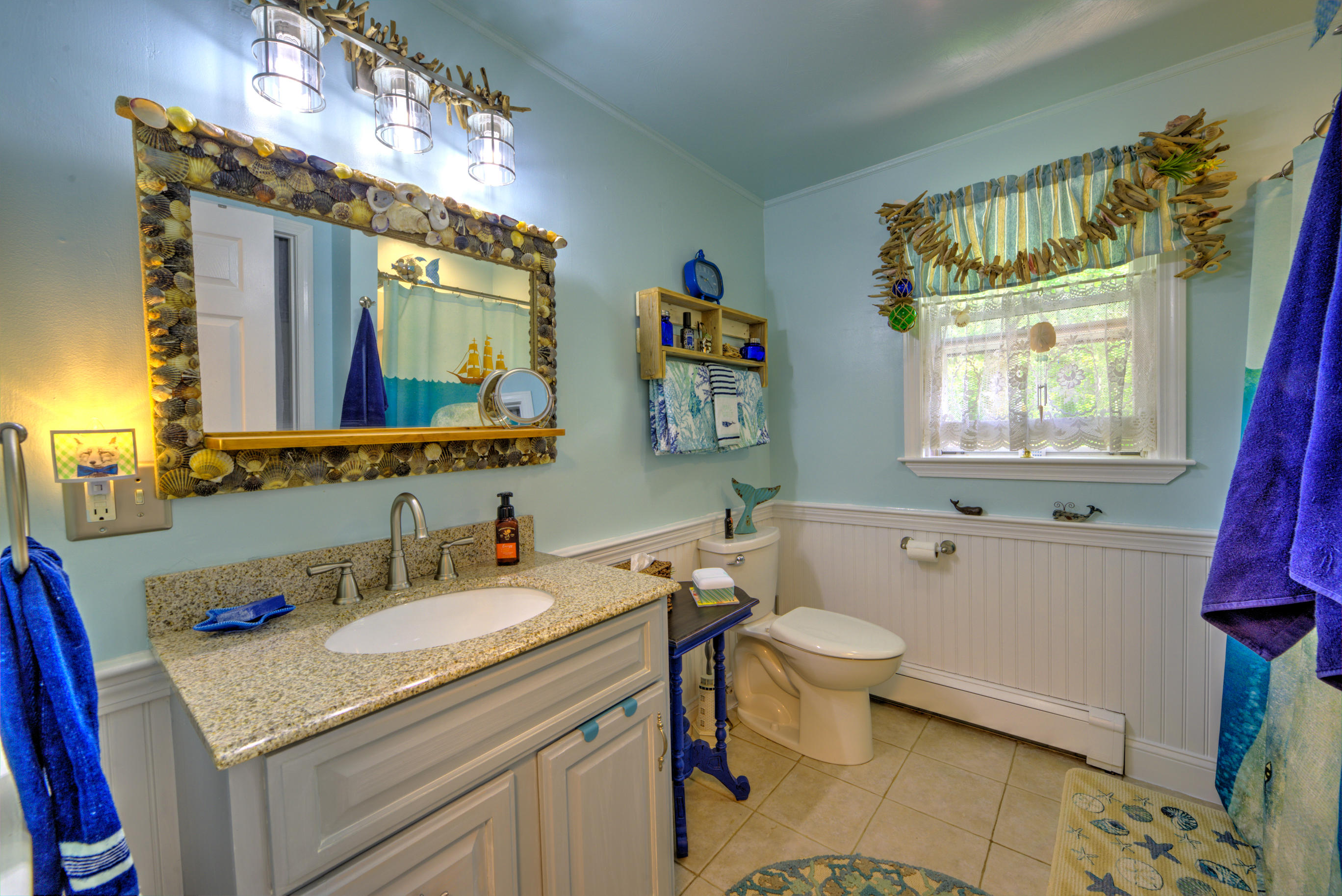 1 Cotuit Road Sandwich, MA 02563 - Photo 21 of 33 a bathroom with a toilet sink and mirror