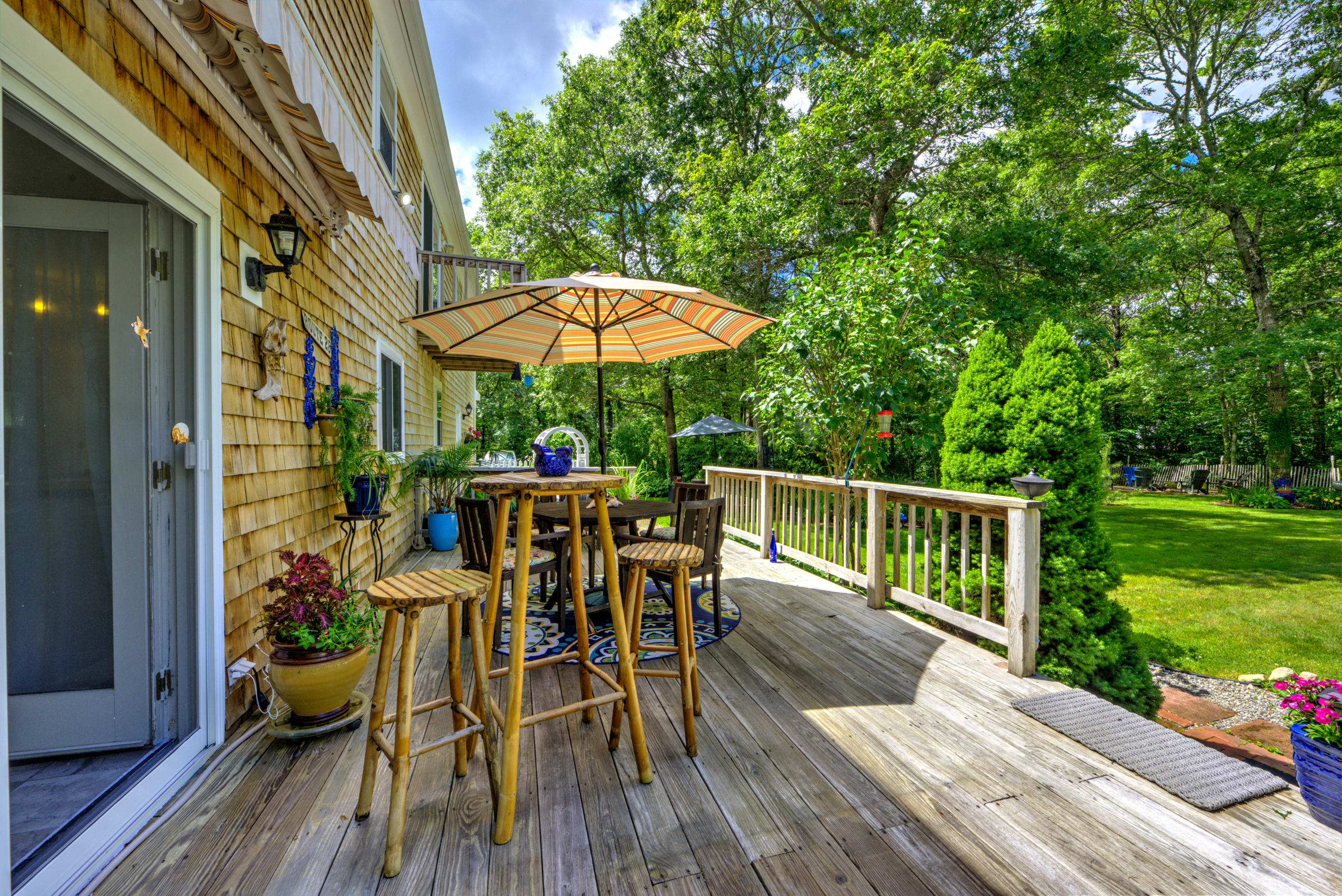 1 Cotuit Road Sandwich, MA 02563 - Photo 27 of 33 a view of balcony with outdoor seating and wooden floor