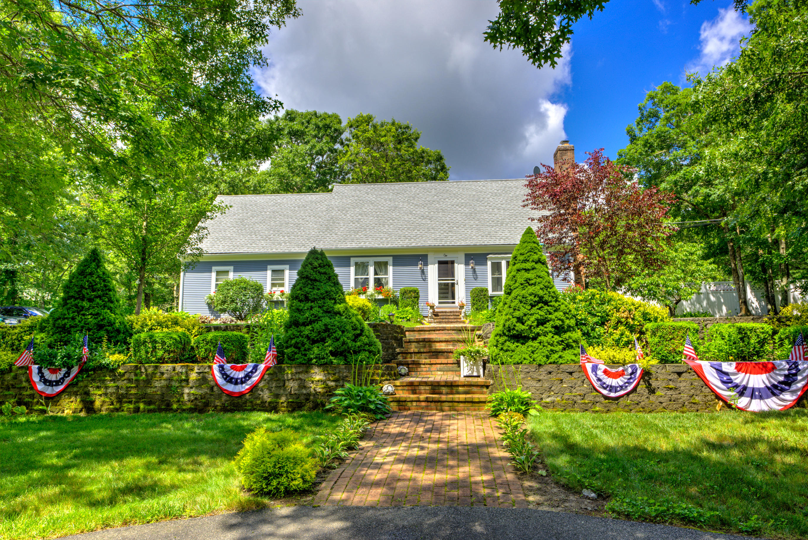 1 Cotuit Road Sandwich, MA 02563 - Photo 3 of 33 a front view of a house with a yard
