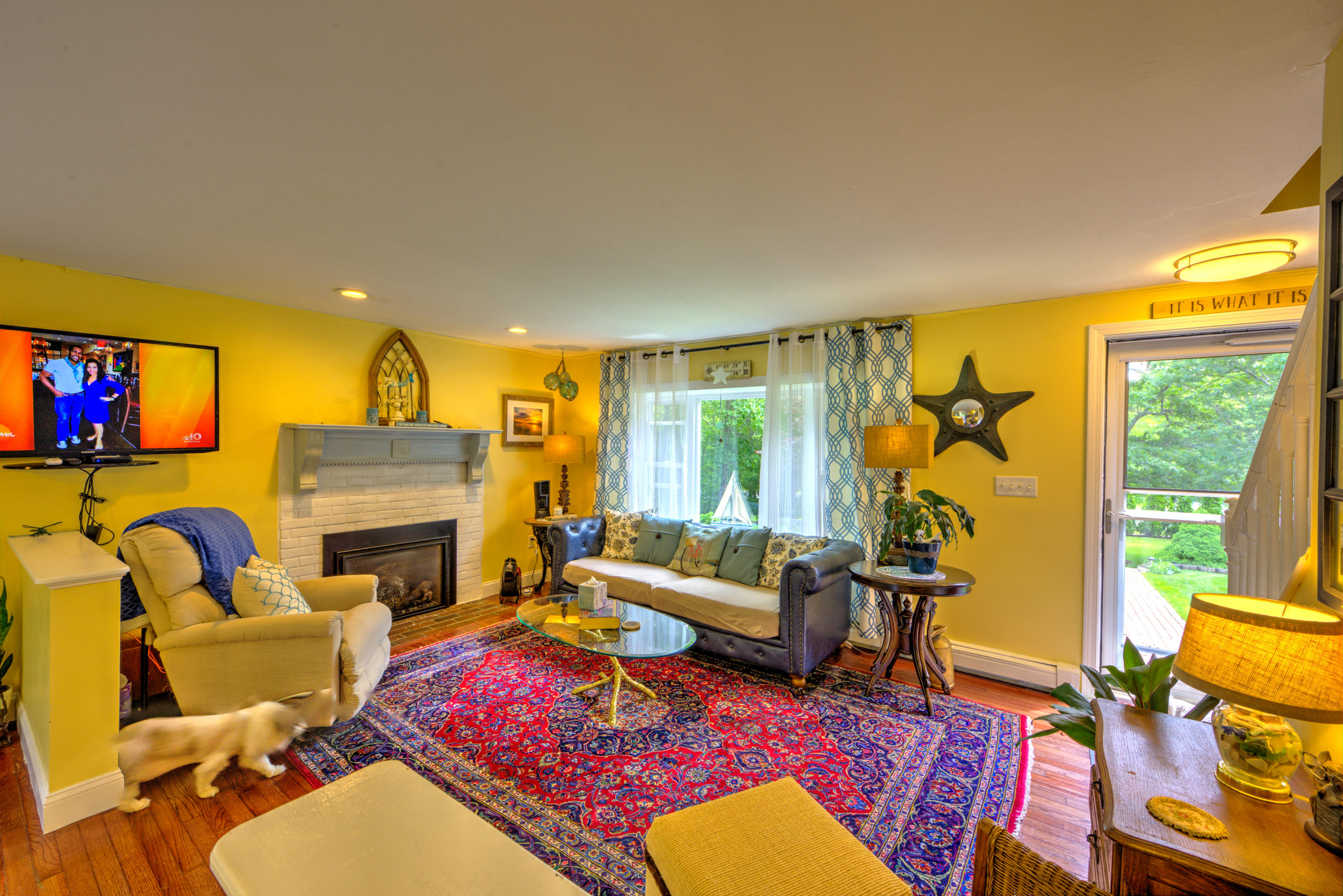 1 Cotuit Road Sandwich, MA 02563 - Photo 4 of 33 a living room with furniture fireplace and a large window