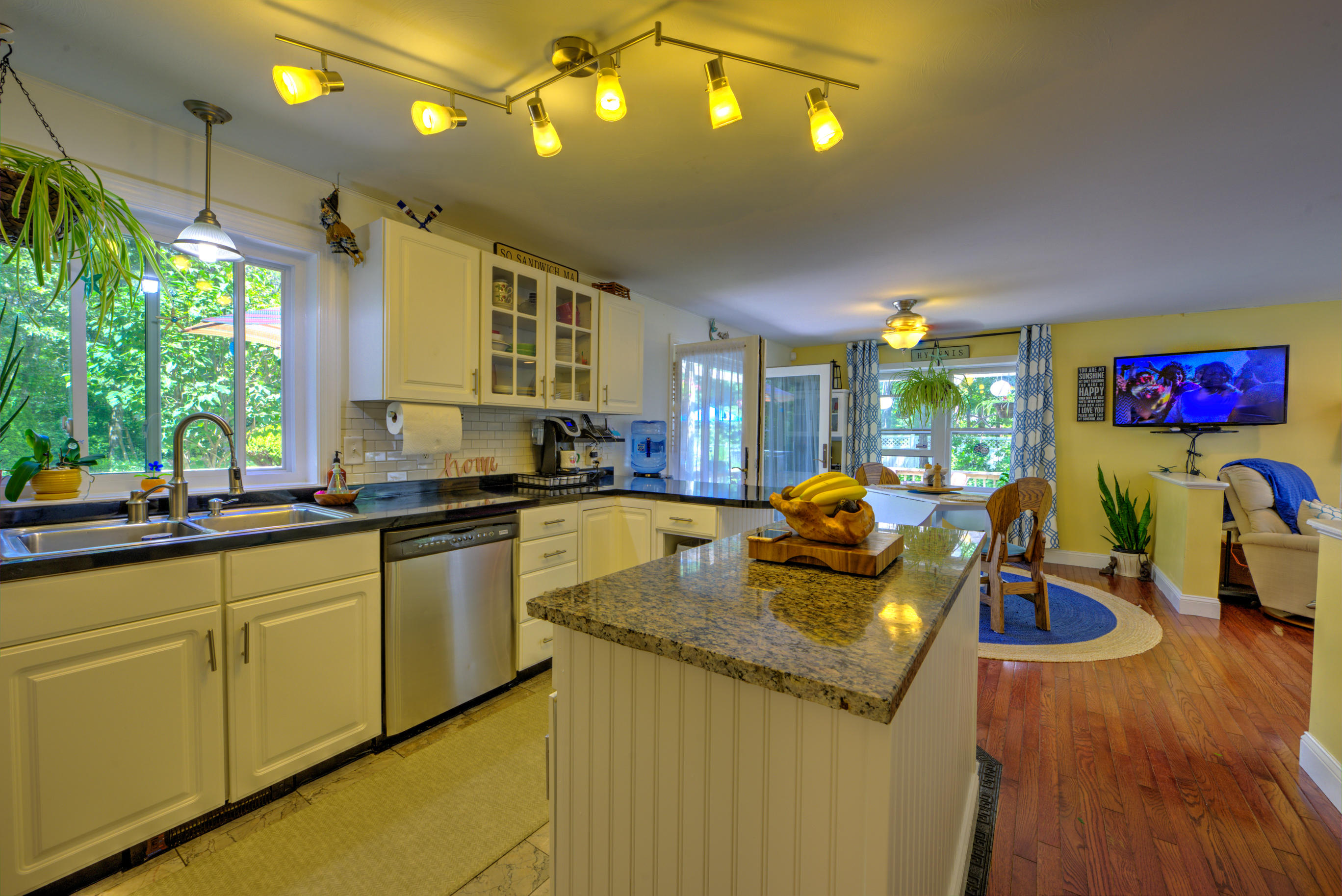 1 Cotuit Road Sandwich, MA 02563 - Photo 6 of 33 a kitchen with lots of counter top space and living room