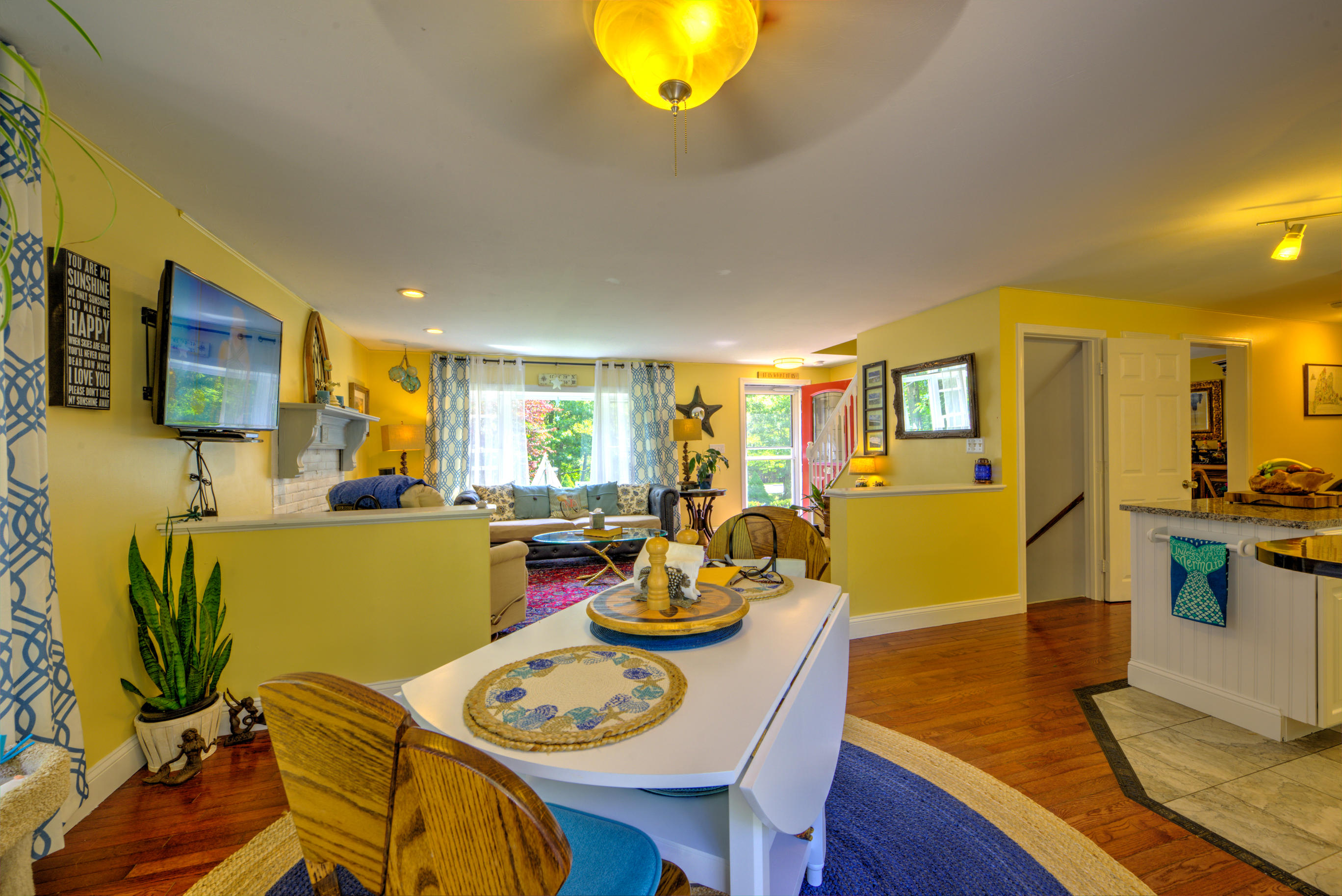1 Cotuit Road Sandwich, MA 02563 - Photo 7 of 33 a view of a dining room with furniture and a kitchen