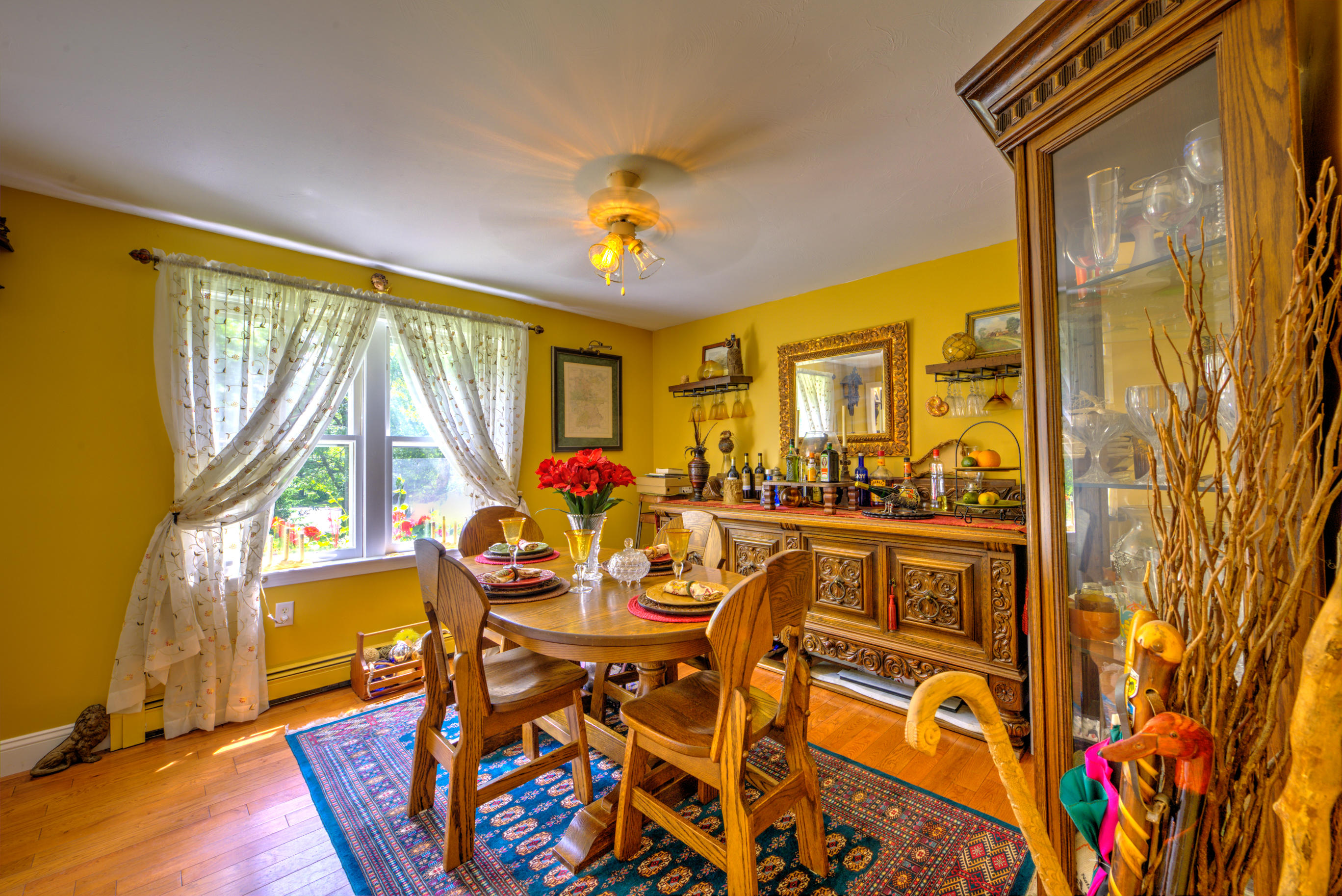 1 Cotuit Road Sandwich, MA 02563 - Photo 10 of 33 a view of a dining room with furniture a chandelier and wooden floor