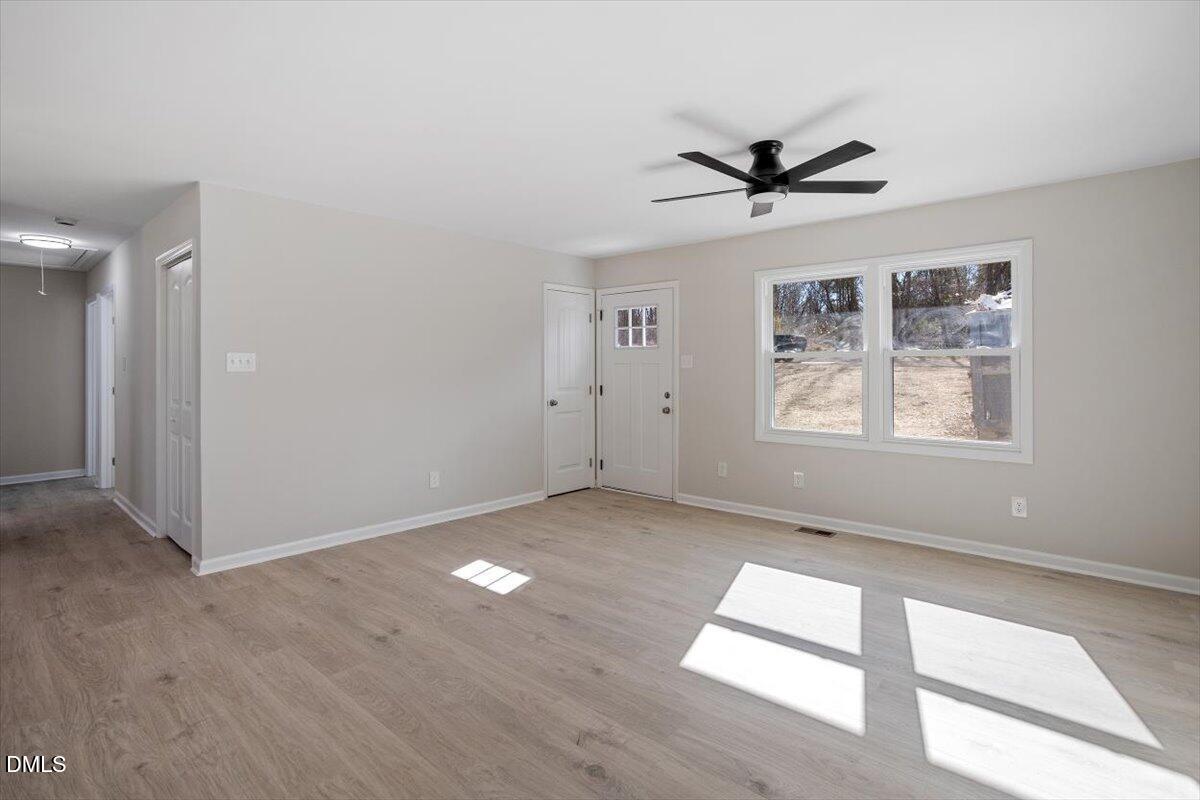 5326 Salem Church Road Graham, NC 27253 - Photo 13 of 20 an empty room with windows and fan