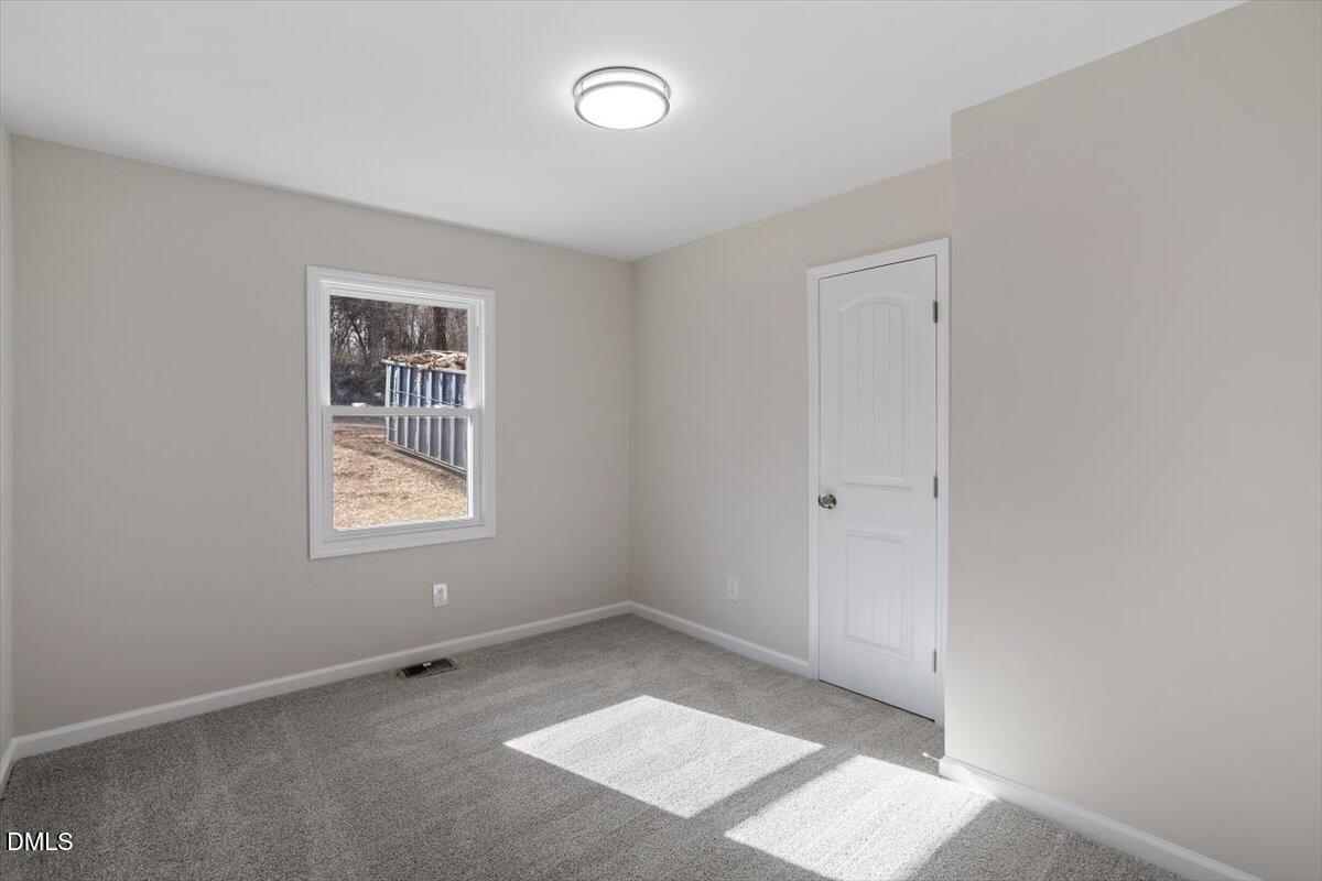 5326 Salem Church Road Graham, NC 27253 - Photo 17 of 20 an empty room with windows