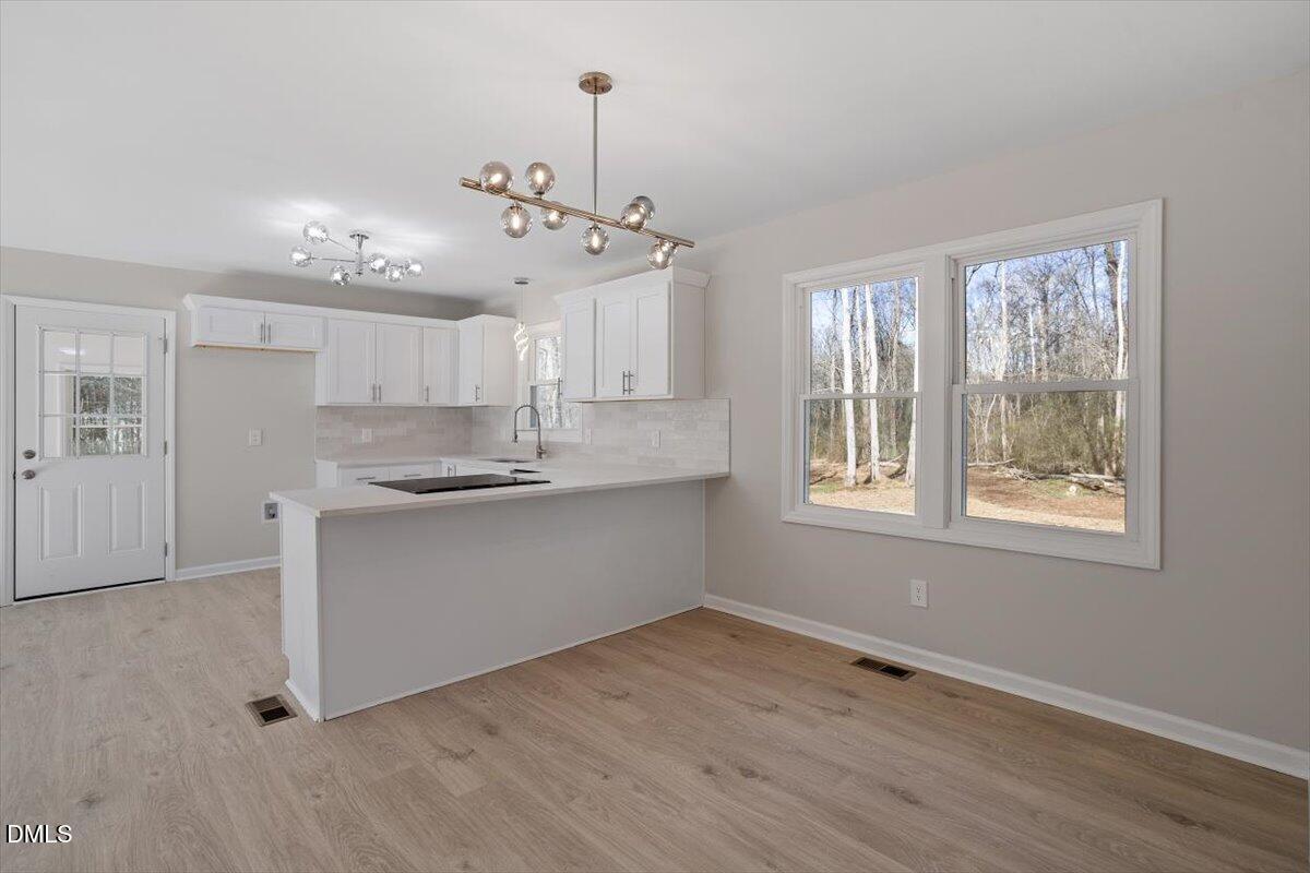 5326 Salem Church Road Graham, NC 27253 - Photo 2 of 20 a large kitchen with hardwood floor and a window