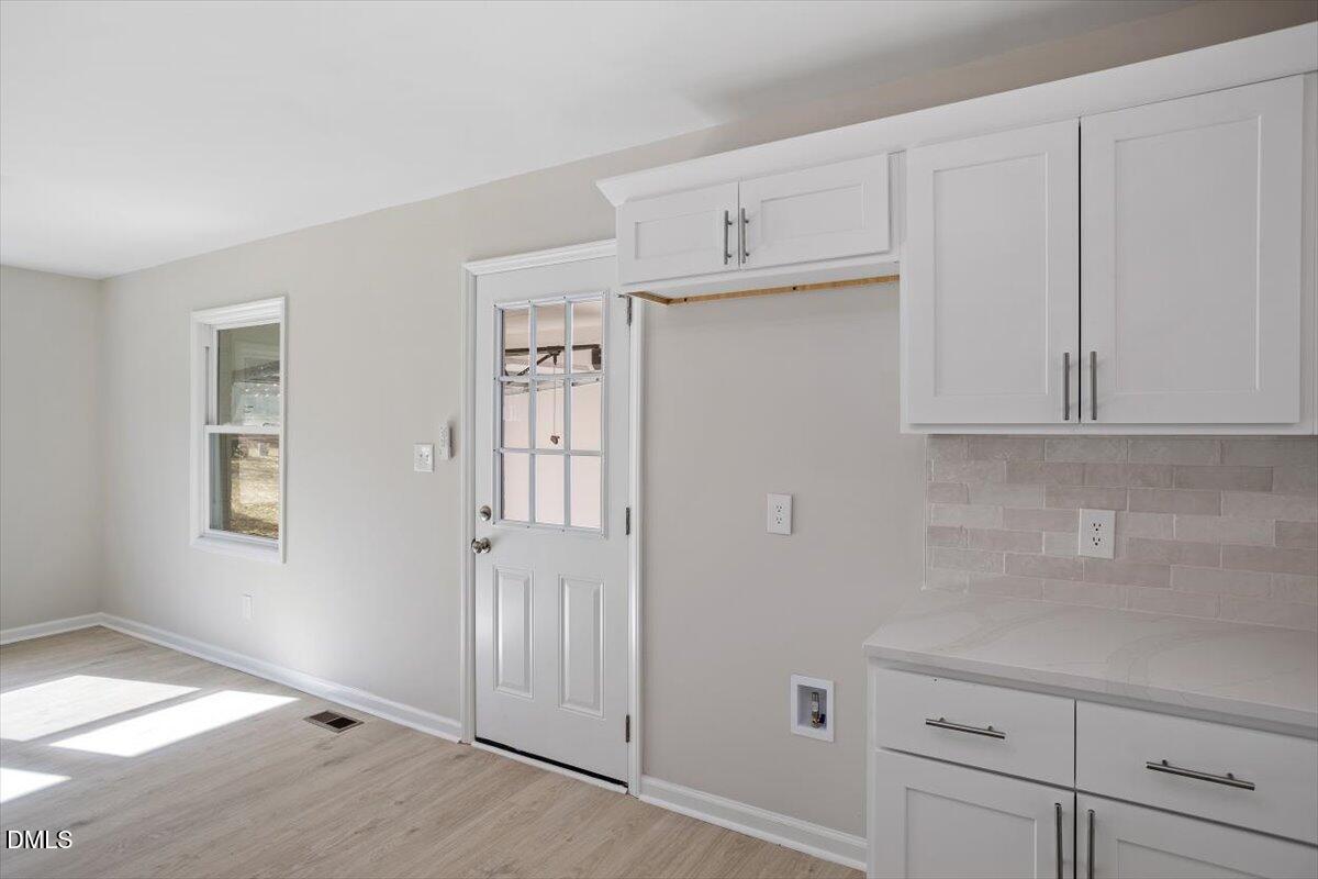 5326 Salem Church Road Graham, NC 27253 - Photo 9 of 20 a view of a kitchen with white cabinets
