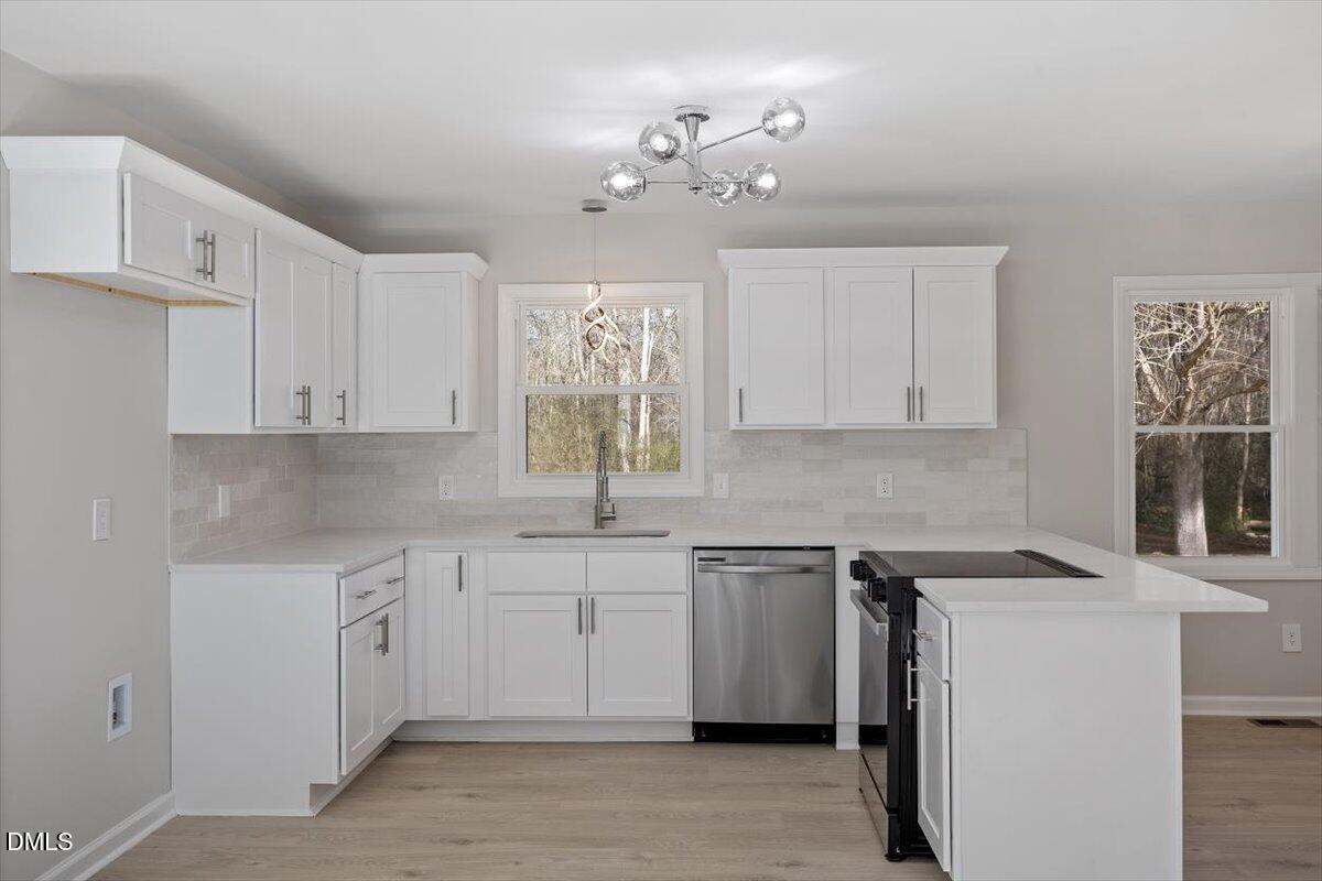 5326 Salem Church Road Graham, NC 27253 - Photo 10 of 20 a kitchen with a sink and cabinets