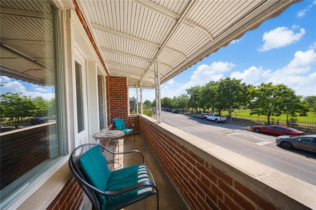 1 Bay Ridge Parkway Brooklyn, NY 11209 - Photo 34 of 38 a view of a patio with lawn chairs next to a yard