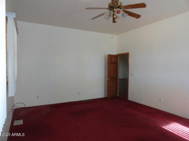8279 East Larson Road Hereford, AZ 85615 - Photo 14 of 22 a view of an empty room with a ceiling fan