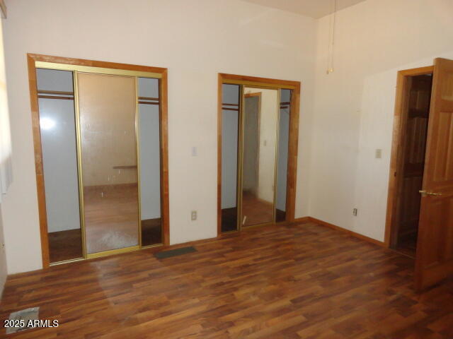 8279 East Larson Road Hereford, AZ 85615 - Photo 16 of 22 a view of an empty room with wooden floor