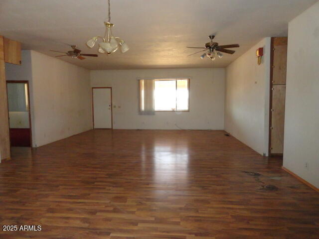 8279 East Larson Road Hereford, AZ 85615 - Photo 7 of 22 a view of an empty room with wooden floor and a window