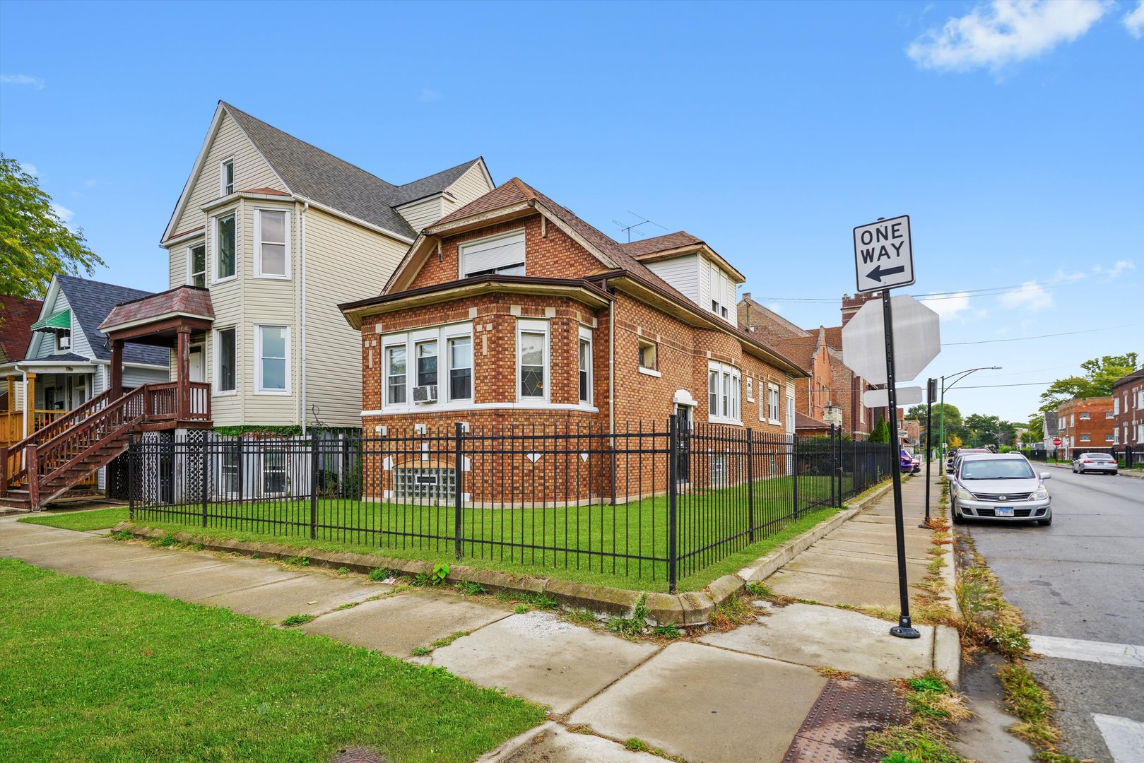 a view of a parked cars in front of house