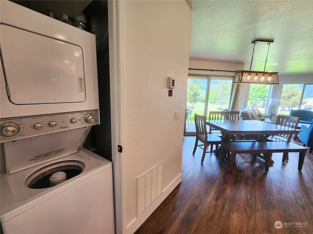 a view of dining room with furniture and wooden floor