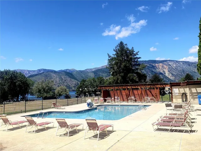 a view of a swimming pool with a patio
