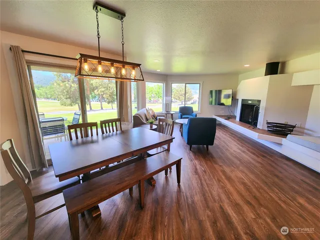 a view of a dining room with furniture window and wooden floor