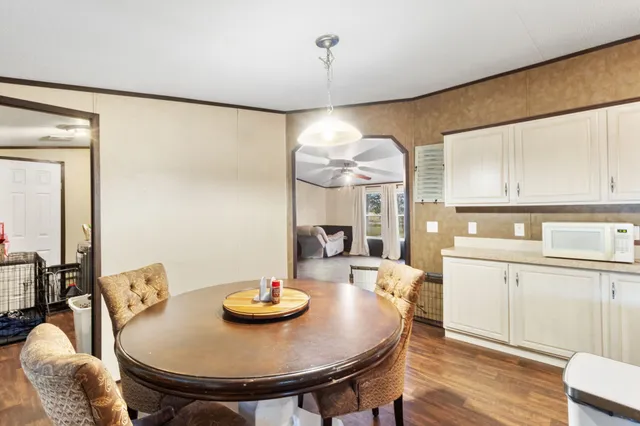 a kitchen with stainless steel appliances granite countertop a sink and a refrigerator