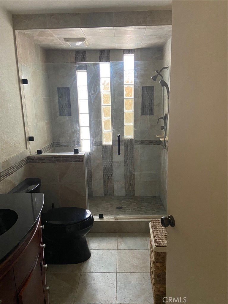 22332 Fallen Leaf Road Lake Forest, CA 92630 - Photo 13 of 33 a bathroom with a sink a toilet and shower