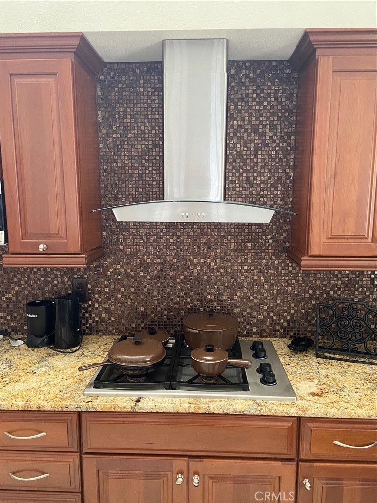 22332 Fallen Leaf Road Lake Forest, CA 92630 - Photo 18 of 33 a kitchen with granite countertop white cabinets and white appliances