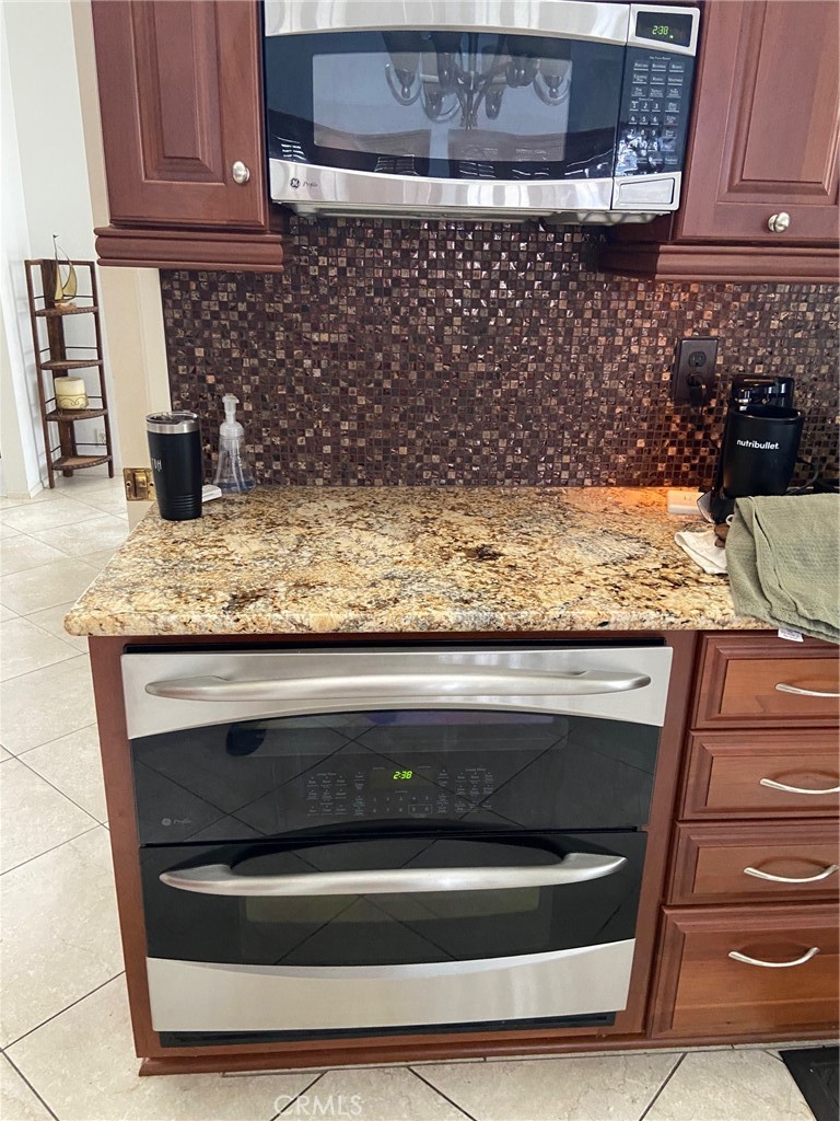 22332 Fallen Leaf Road Lake Forest, CA 92630 - Photo 20 of 33 a bathroom with granite countertop granite top and stainless steel appliances
