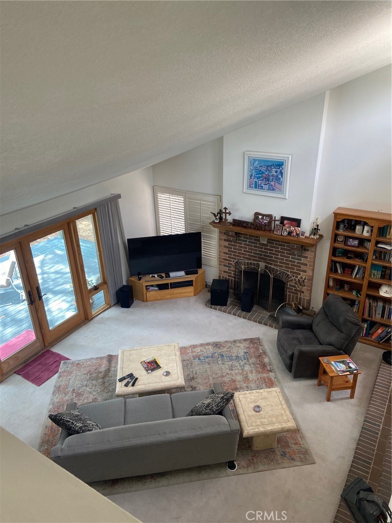 22332 Fallen Leaf Road Lake Forest, CA 92630 - Photo 21 of 33 a living room with furniture and a flat screen tv