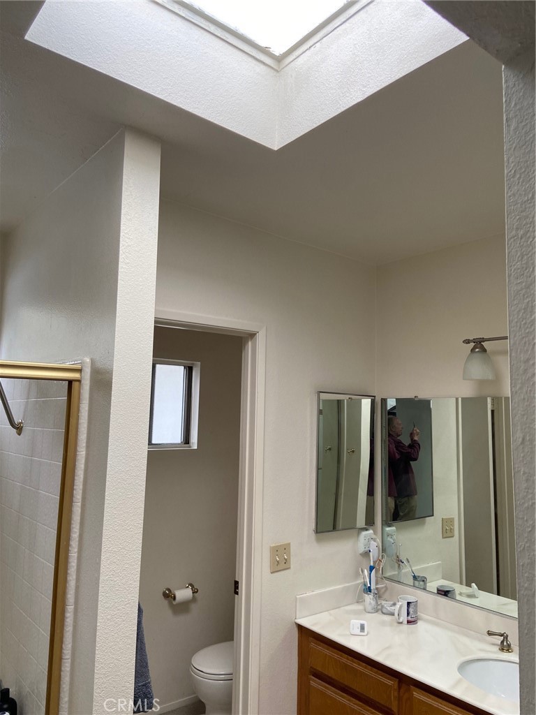 22332 Fallen Leaf Road Lake Forest, CA 92630 - Photo 26 of 33 a bathroom with a double vanity sink and a mirror