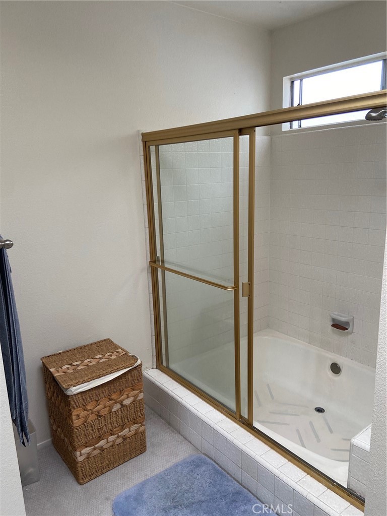 22332 Fallen Leaf Road Lake Forest, CA 92630 - Photo 27 of 33 a bathroom with a glass shower door