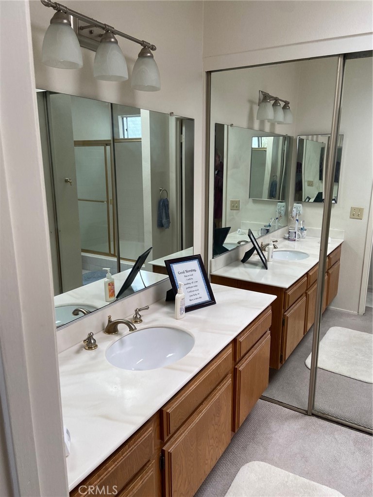 22332 Fallen Leaf Road Lake Forest, CA 92630 - Photo 28 of 33 a bathroom with a double vanity sink mirror and double