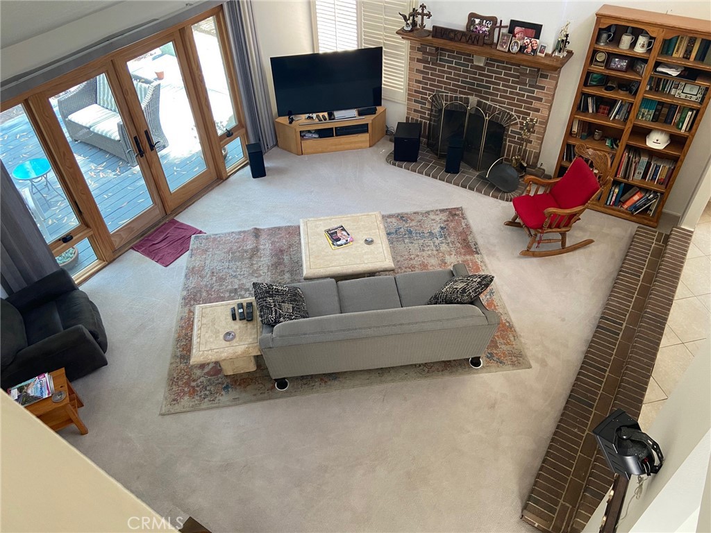 22332 Fallen Leaf Road Lake Forest, CA 92630 - Photo 30 of 33 a living room with furniture and a flat screen tv