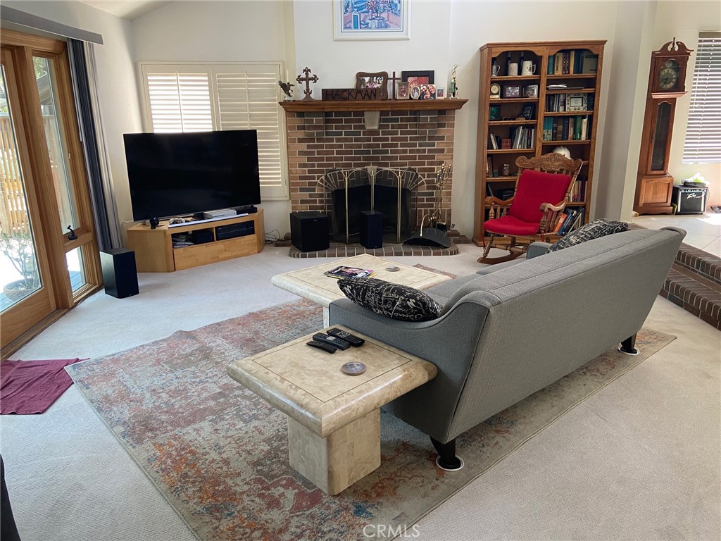 22332 Fallen Leaf Road Lake Forest, CA 92630 - Photo 31 of 33 a living room with furniture and a flat screen tv