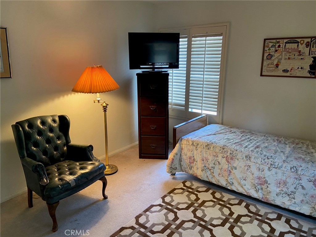 22332 Fallen Leaf Road Lake Forest, CA 92630 - Photo 32 of 33 a bedroom with a bed and a television