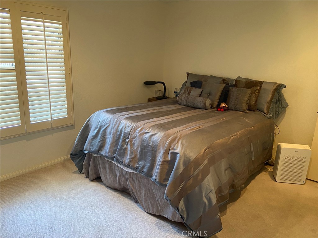 22332 Fallen Leaf Road Lake Forest, CA 92630 - Photo 33 of 33 a bedroom with a bed and window