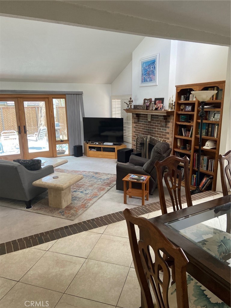 22332 Fallen Leaf Road Lake Forest, CA 92630 - Photo 9 of 33 a living room with furniture and a flat screen tv