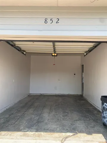 a view of backyard with wooden fence