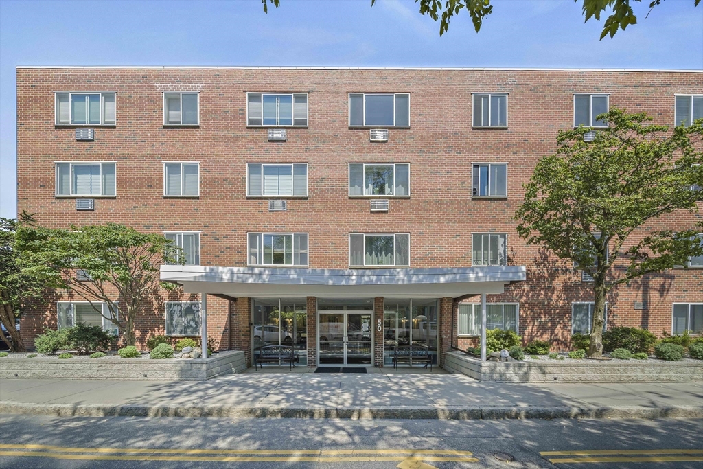 50 Green Street, Unit 108 Brookline, MA 02446 - Photo 1 of 22 a front view of a building with garden