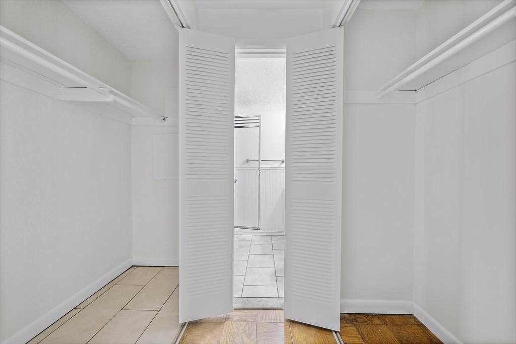 50 Green Street, Unit 108 Brookline, MA 02446 - Photo 12 of 22 a view of front door with wooden floor