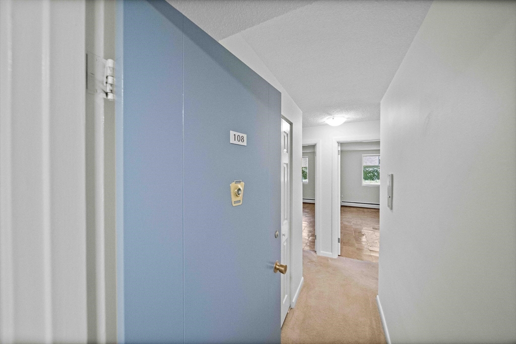 50 Green Street, Unit 108 Brookline, MA 02446 - Photo 4 of 22 a view of a hallway with closet