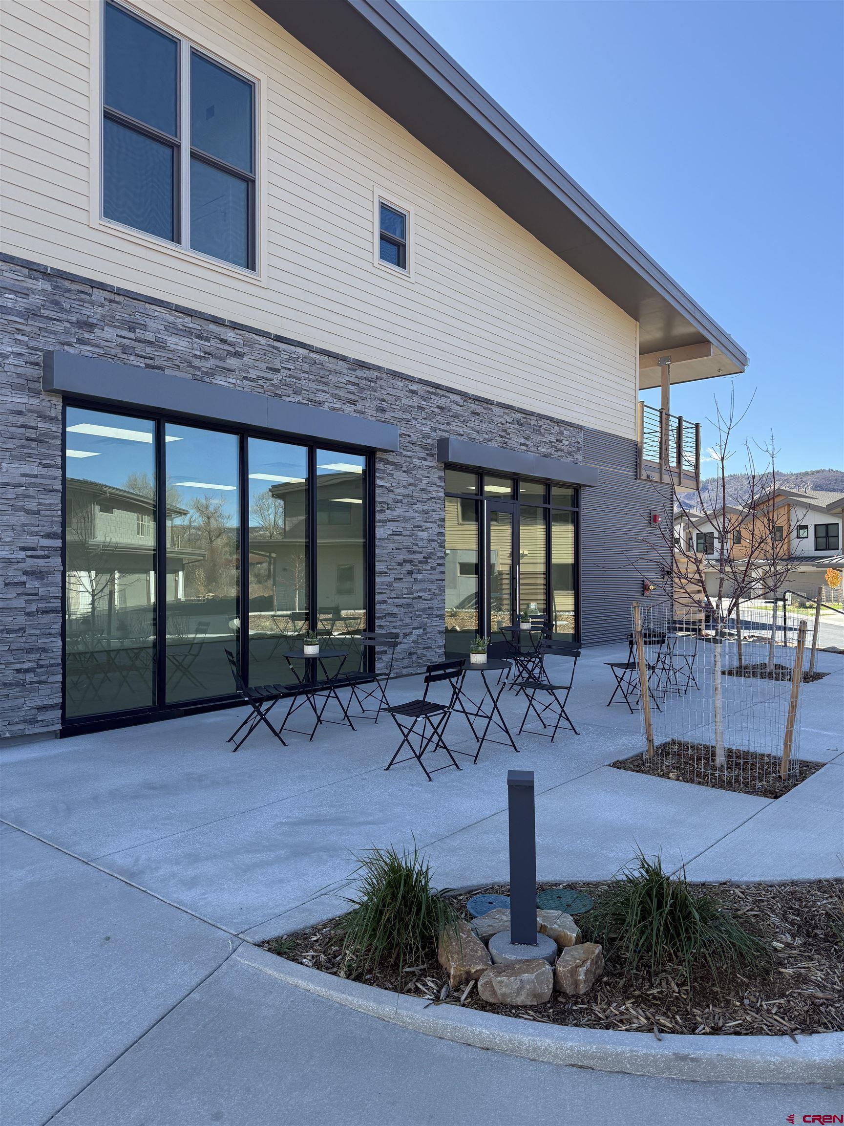 205 Jasper Lane, Unit 104 Ridgway, CO 81432 - Photo 5 of 34 a front view of a house with garden