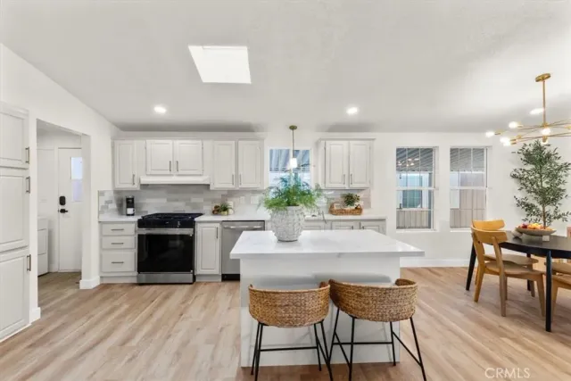 a kitchen with a table and chairs in it