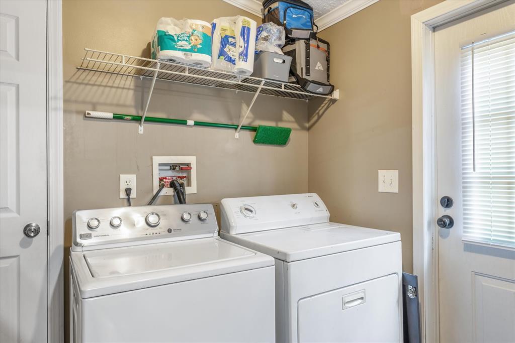 13902 East Travis Lane Log Cabin, TX 75148 - Photo 20 of 24 a utility room with dryer and washer