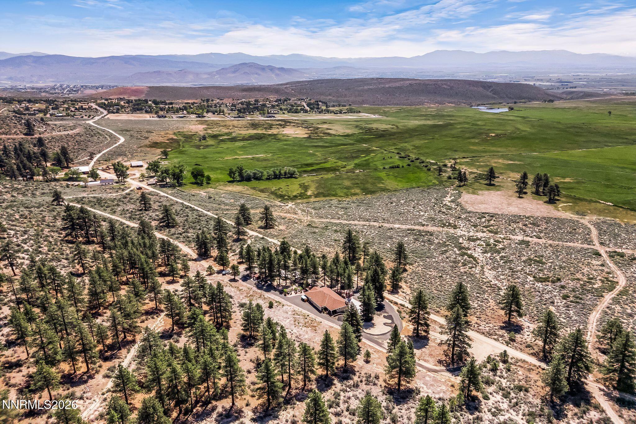 250 Jacks Valley Ranch Road Carson City, NV 89705 - Photo 42 of 44 a view of a town with mountains in the background