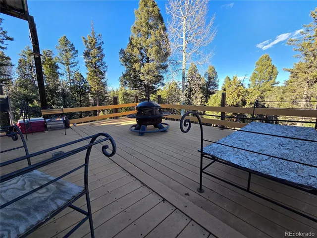 a bench sitting on top of a wooden floor
