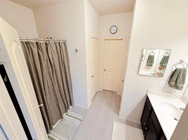 a view of a bathroom from the door